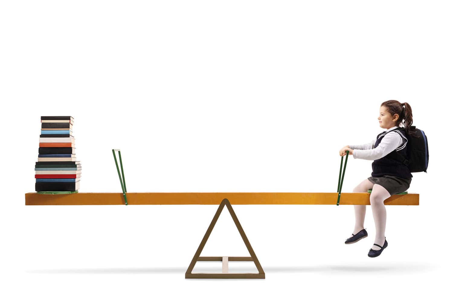 photo of school girl in uniform with rucksack on her back sitting on balance see-saw with a pile of books on the other end